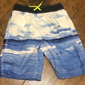 Blue wave swim trunks and rash guard